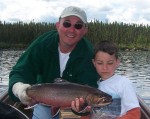 Mike Jr. poses with dad and another giant brook trout!